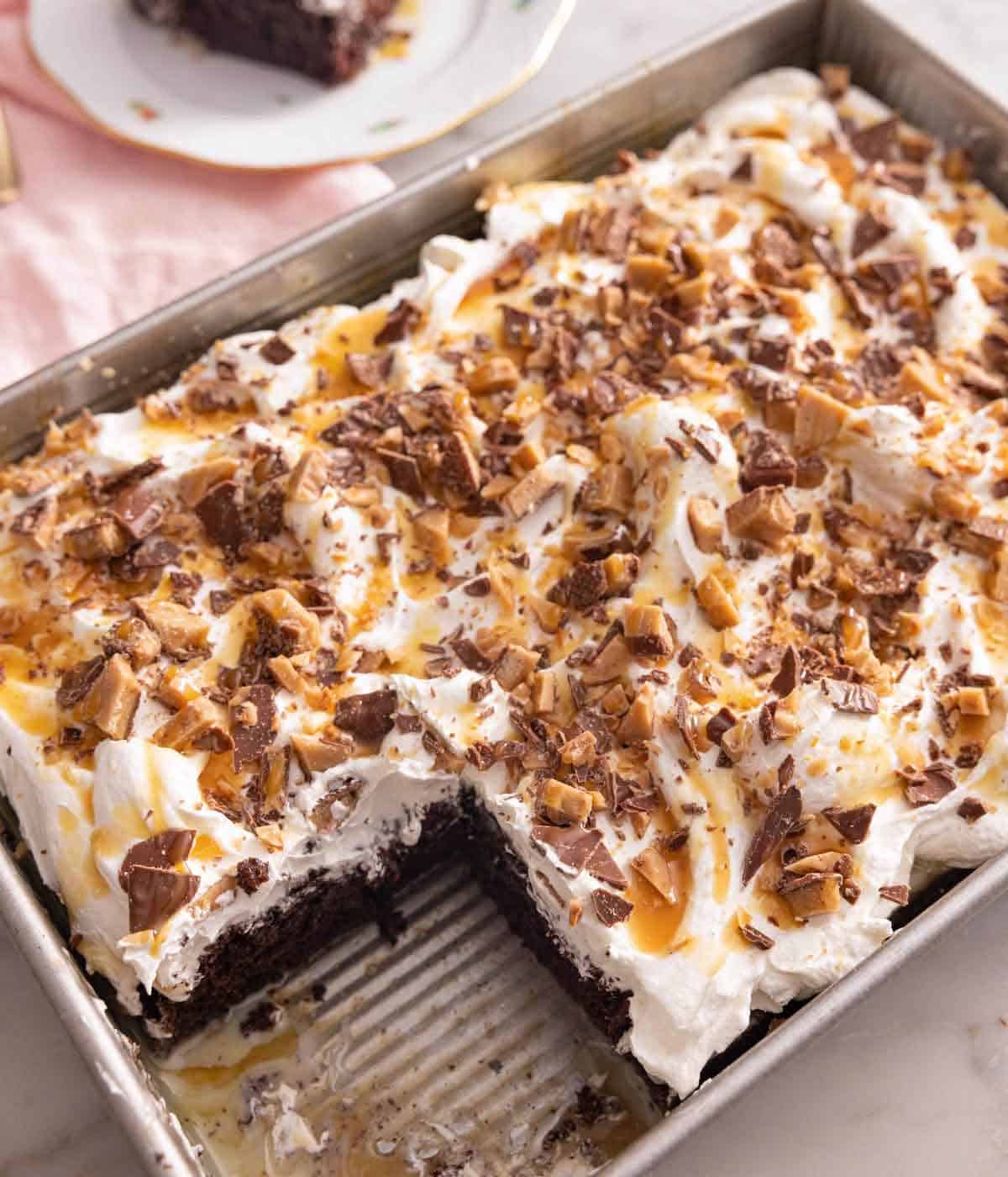 Overhead view of a pan of better than sex cake with a slice taken out.