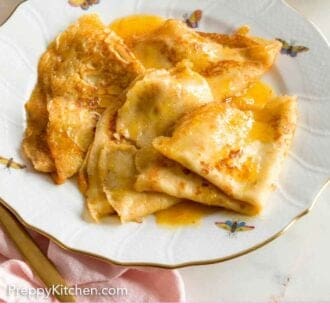Pinterest graphic of a plate with a couple of crepe suzette.