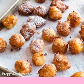 Pinterest graphic of zeppole on a paper towel with some dusted with sugar.