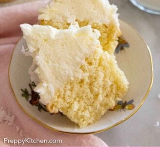 Pinterest graphic of a small plate with a coconut cupcake cut in half.