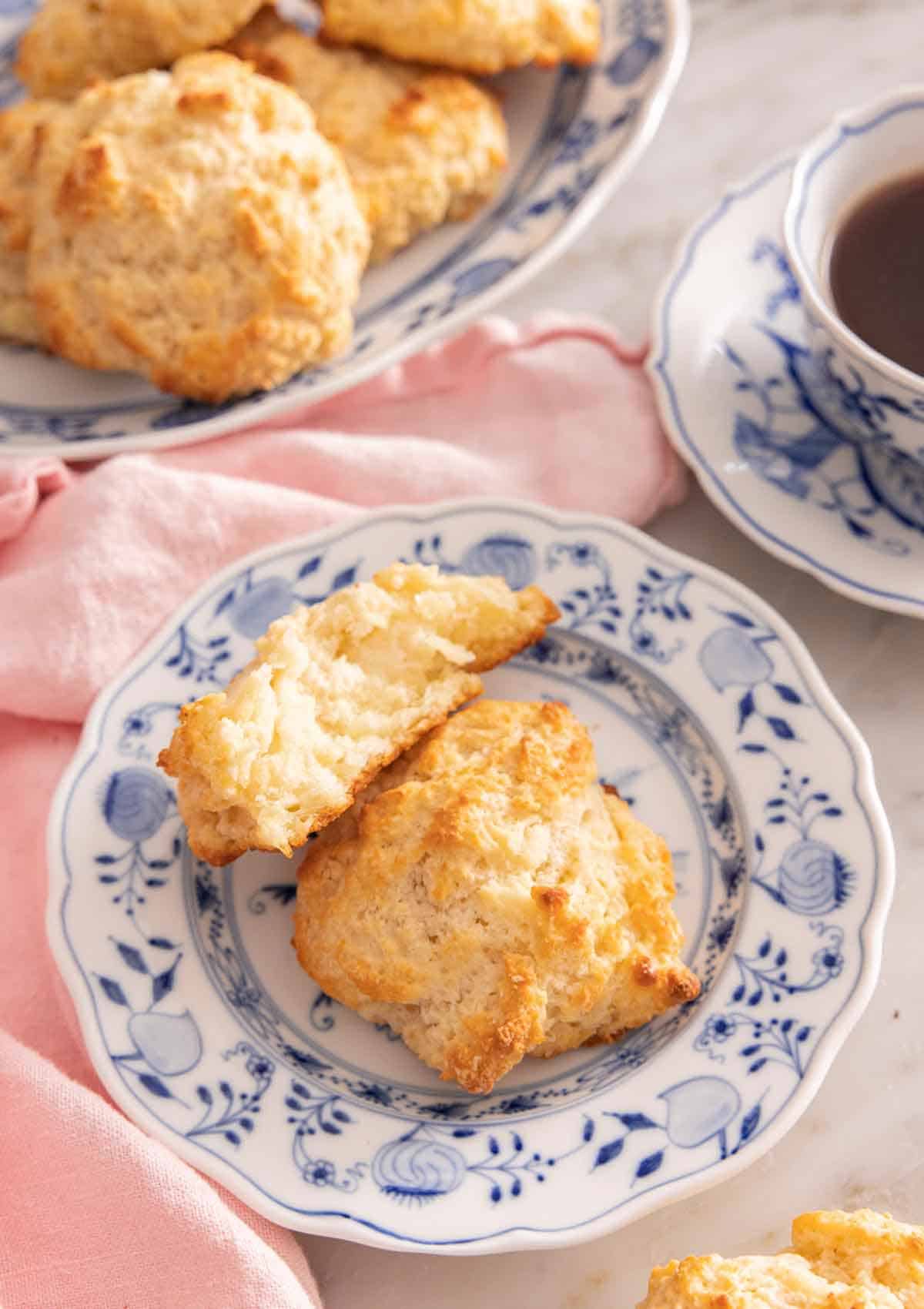 A plate with a drop biscuit with half of one, propped on top.