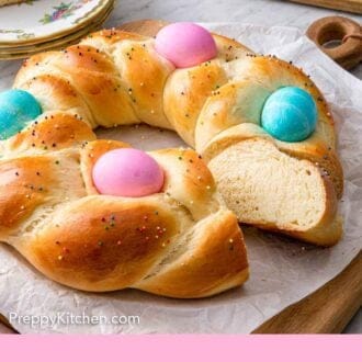 Pinterest graphic of an Easter bread with a slice cut and angled to show the crumb.
