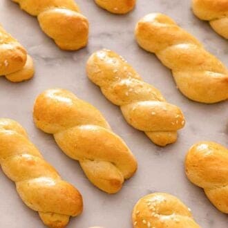 Multiple koulourakia lying flat in a single layer.