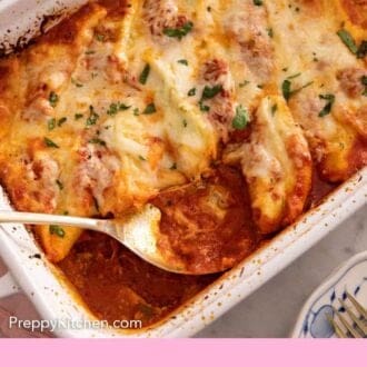 Pinterest graphic of an overhead view of a spoon inside of a baking dish of stuffed shells.