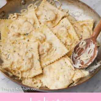 Pinterest graphic of a close view of a skillet of lobster ravioli in a creamy sauce.