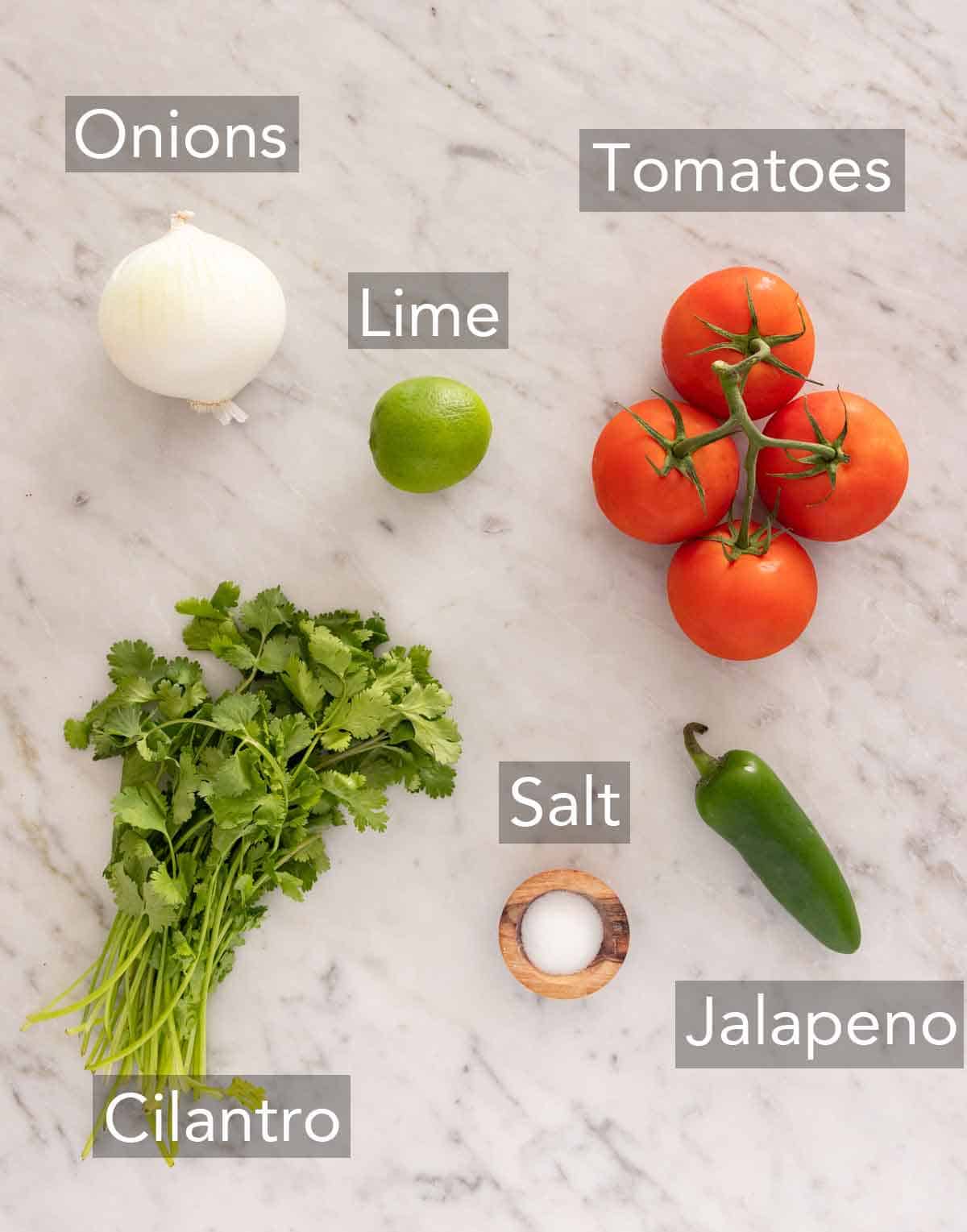 Ingredients needed to make pico de gallo.