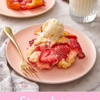 Pinterest graphic of a plate of strawberry cobbler with vanilla ice cream on top.