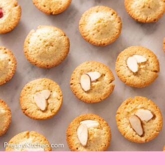 Pinterest graphic of rows of financiers, some with raspberries on top and some with sliced almonds on top.