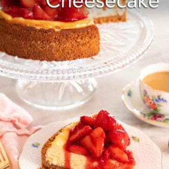 Pinterest graphic of a slice of strawberry cheesecake on a plate in front of a cut cheesecake on a cake stand.