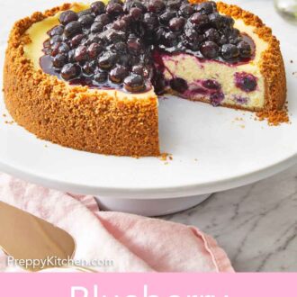 Pinterest graphic of a cake stand with a blueberry cheesecake with a slice cut out.