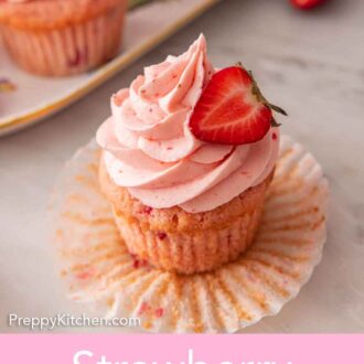 Pinterest graphic of a strawberry cupcake with the paper cupcake liner pulled down.
