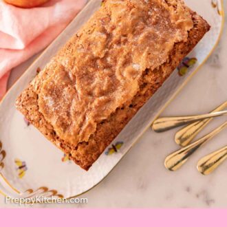 Pinterest graphic of an overhead view of a platter of apple bread with an apple and some forks on the side.