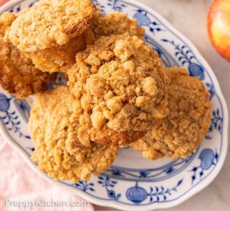 Pinterest graphic of an overhead view of a platter of apple muffins.