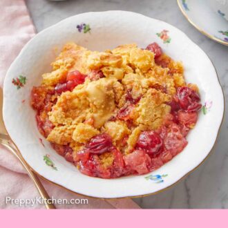 Pinterest graphic of a bowl with a serving of dump cake in it.