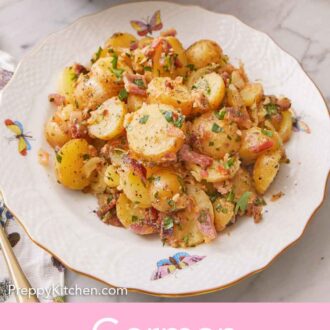 Pinterest graphic of a plate of German potato salad with chopped parsley on top.
