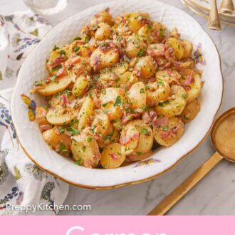 Pinterest graphic of a platter of German potato salad with serving plates, forks, and a spoon on the side.