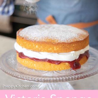 Pinterest graphic of powder sugar being dusted over a Victoria sponge cake on a cake stand.