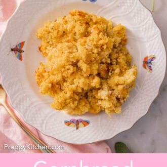 Pinterest graphic of an overhead view of a plate of cornbread dressing with fresh sage on the side.