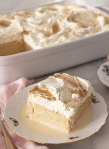 A peanut butter tres leches cake piece on a plate.