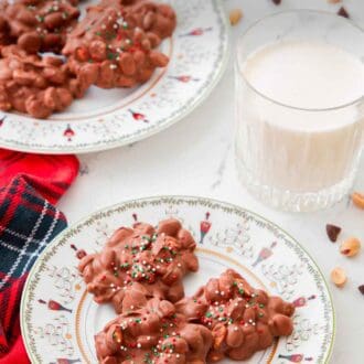 Pinterest graphic of a plate with three pieces of crockpot candy with milk on the back with additional candies in the back.