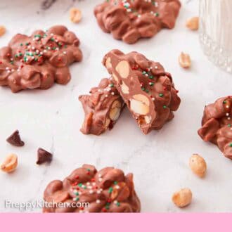 Pinterest graphic of multiple pieces of crockpot candy on a marble surface with one in the middle cut in half.