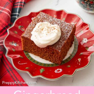 Pinterest graphic of a red plate with a square slice of gingerbread cake with a dollop of whipped cream on top.