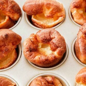 Baked Yorkshire pudding inside of a muffin tin.