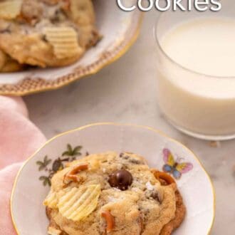 Pinterest graphic of a plate with a kitchen sink cookie with a glass of milk and additional cookie platter behind it.