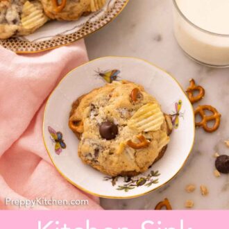 Pinterest graphic of an overhead view of a kitchen sink cookie in a small plate with a glass of milk and more cookies beside it.
