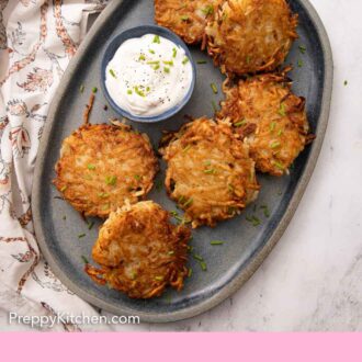 Pinterest graphic of an an overhead view of an oval platter of potato pancakes with a small bowl of sour cream.