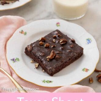Pinterest graphic of a plate with a square slice of Texas sheet cake with a glass of milk in the background.