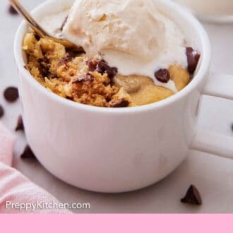 Pinterest graphic of a cookie in a mug with a scoop of ice cream on top and a spoon digging in.