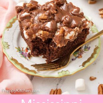 Pinterest graphic of a plate with a square slice of Mississippi mud cake with a bite taken out of the corner.