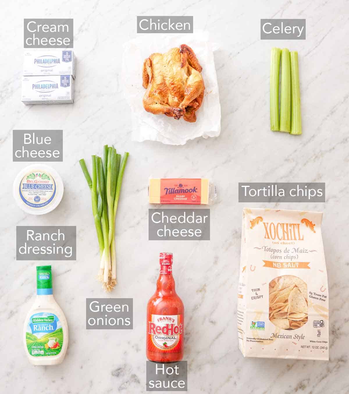 Ingredients needed to make buffalo chicken dip.