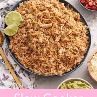 Pinterest graphic of a large bowl of slow cooker carnitas with assorted bowls of toppings on the side.