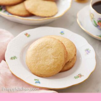 Pinterest graphic of a plate with a stack of three honey cookies with a platter in the background.