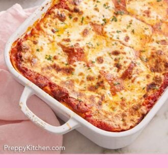 Pinterest graphic of lasagna in a white baking dish.