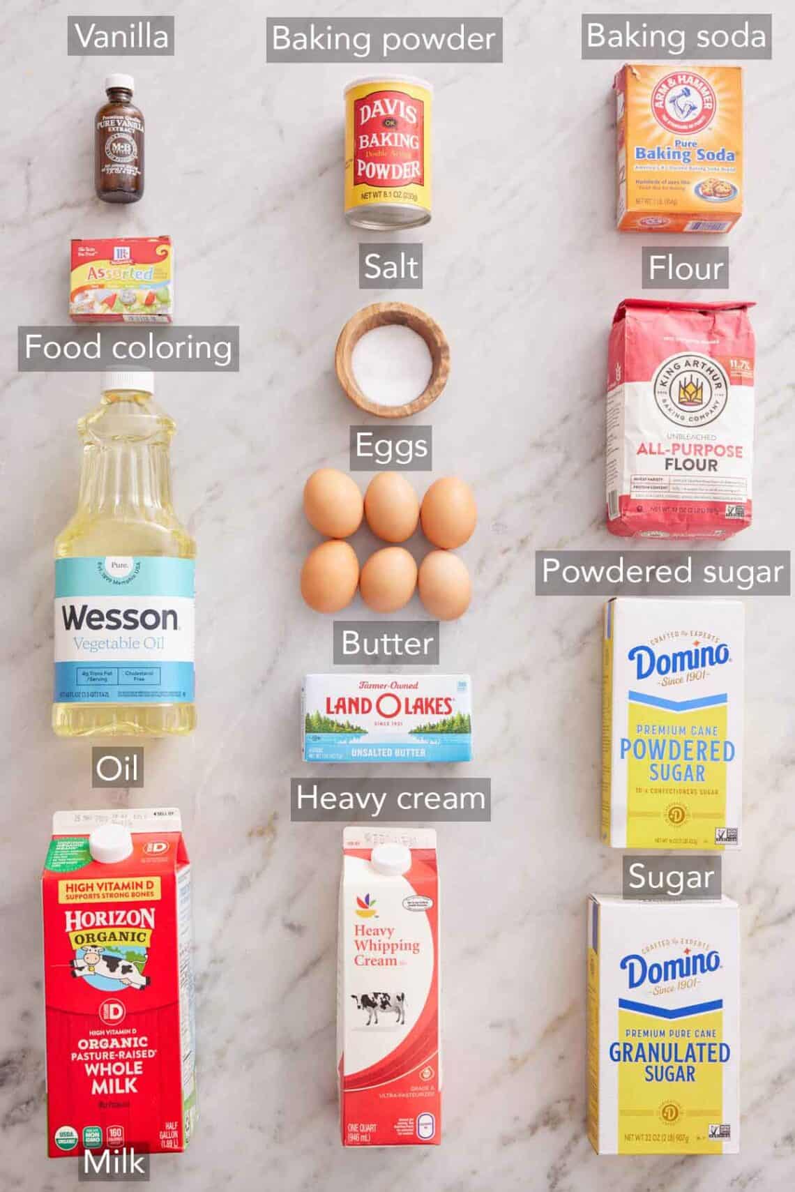 Ingredients needed to make a rainbow cake.