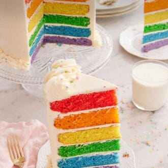 Pinterest graphic of a slice of rainbow cake with a glass of milk, a second plated slice, and the cut cake on a cake stand in the background.