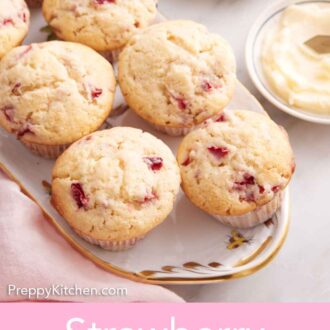 Pinterest graphic of an overhead view of a platter of multiple strawberry muffins with a small bowl of butter beside them.