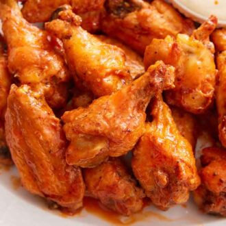 A close up view of a platter of air fryer chicken wings.