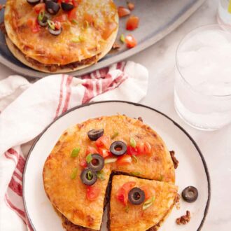 Pinterest graphic of a plate with a Mexican pizza with a slice cut with a platter in the back with two more.