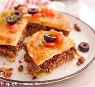 Pinterest graphic of a close up view of a plate of a Mexican pizza with a slice cut, slightly pulled forward.