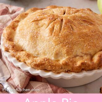 Pinterest graphic of an apple pie in a white pie dish with a stack of plates and some apples in the background.