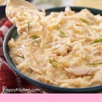 Pinterest graphic of a spoonful of avgolemono lifted from a bowl.