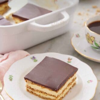 Pinterest graphic of a plate with a slice of éclair cake with a baking dish in the background.