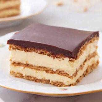 A plate with a square slice of éclair cake.