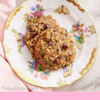 Pinterest graphic of overhead view of a plate with two zucchini cookies with a glass of milk off to the side.