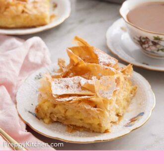 Pinterest graphic of a plate with a slice of Bougatsa with a drink, second plated serving, and baking pan in the background.
