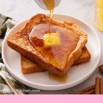 Pinterest graphic of a plate with two pieces of french toast with butter on top and maple syrup poured on top.